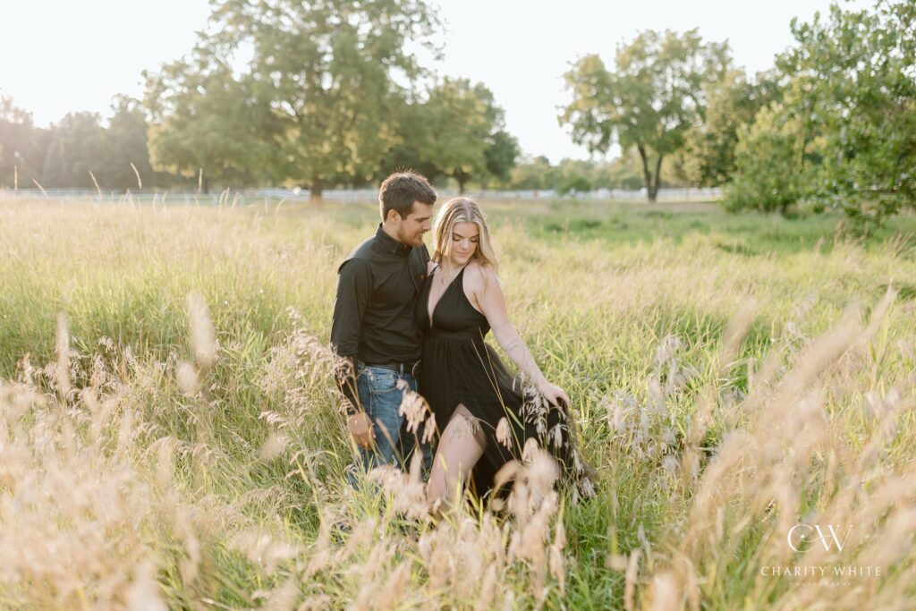 A couple poses for their country themed engagement photos at Danada Equestrian center in Wheaton Illinois.