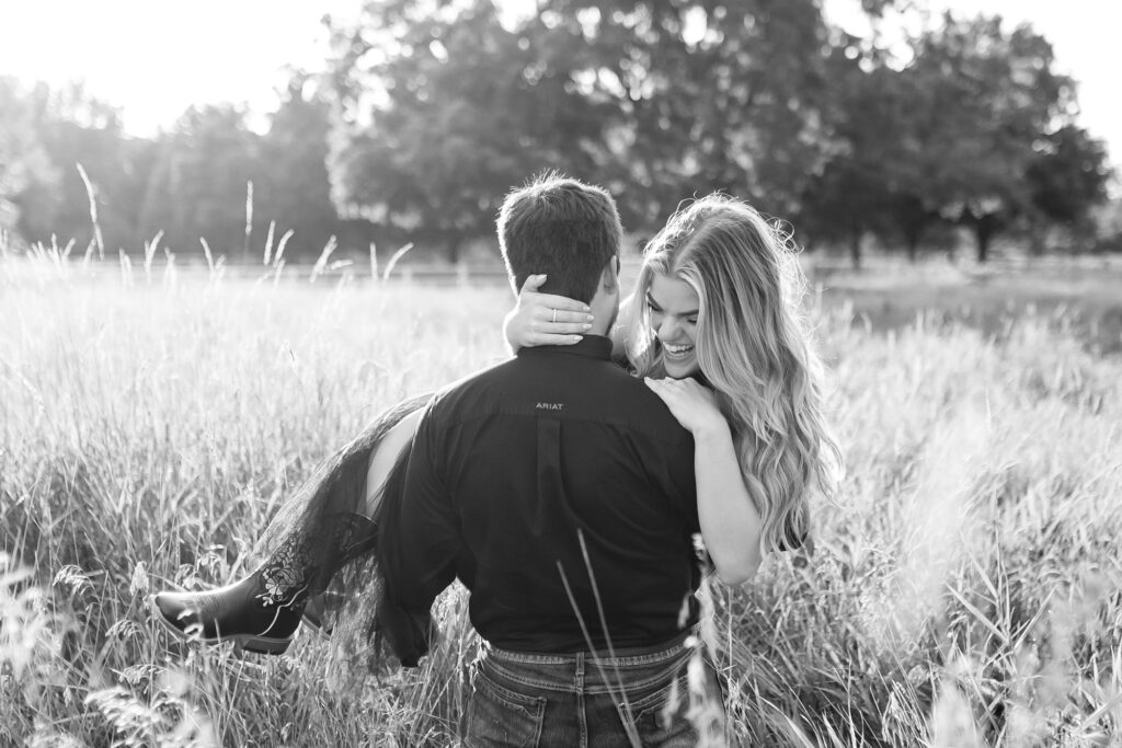 A couple poses for their country themed engagement photos at Danada Equestrian center in Wheaton Illinois.