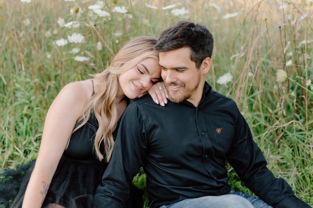 A couple poses for their country themed engagement photos at Danada Equestrian center in Wheaton Illinois.