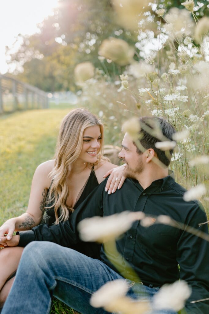 A couple poses for their country themed engagement photos at Danada Equestrian center in Wheaton Illinois.