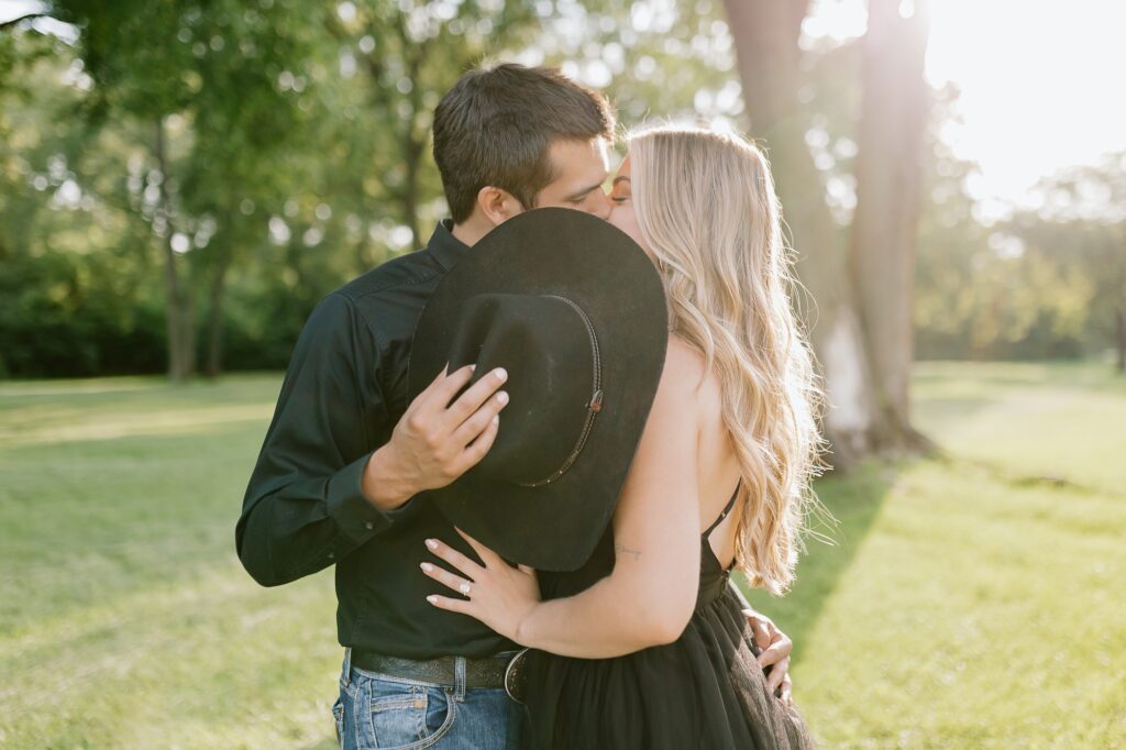 A couple poses for their country themed engagement photos at Danada Equestrian center in Wheaton Illinois.