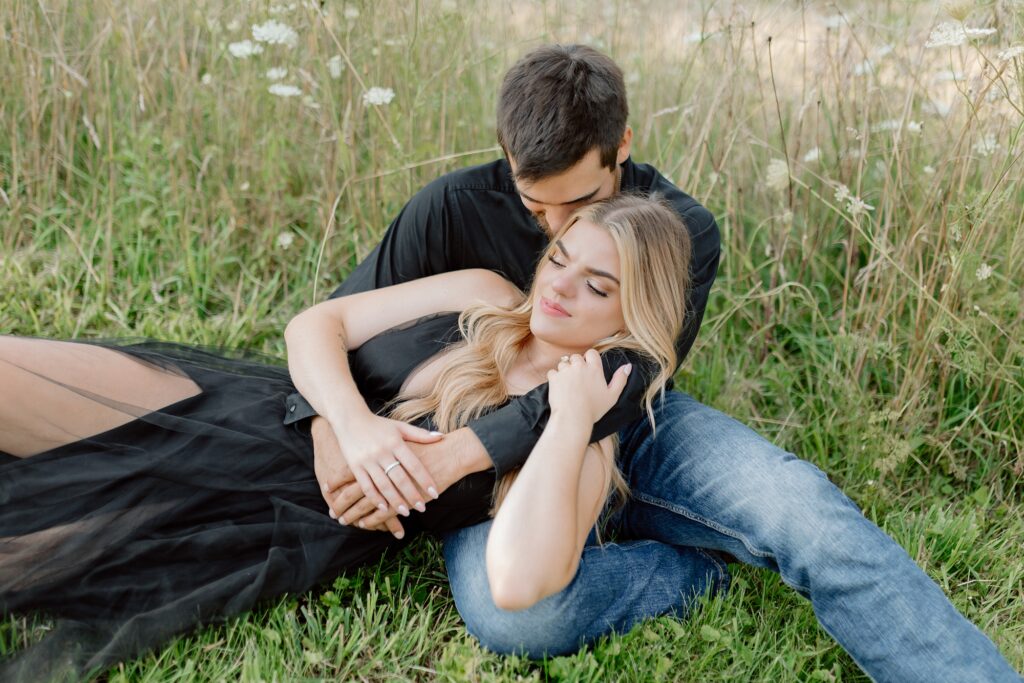 A couple poses for their country themed engagement photos at Danada Equestrian center in Wheaton Illinois.