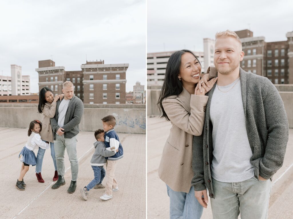 A husband and wife pose on a rooftop in downtown Aurora, Illinois for their family photos taken by Charity White Photography