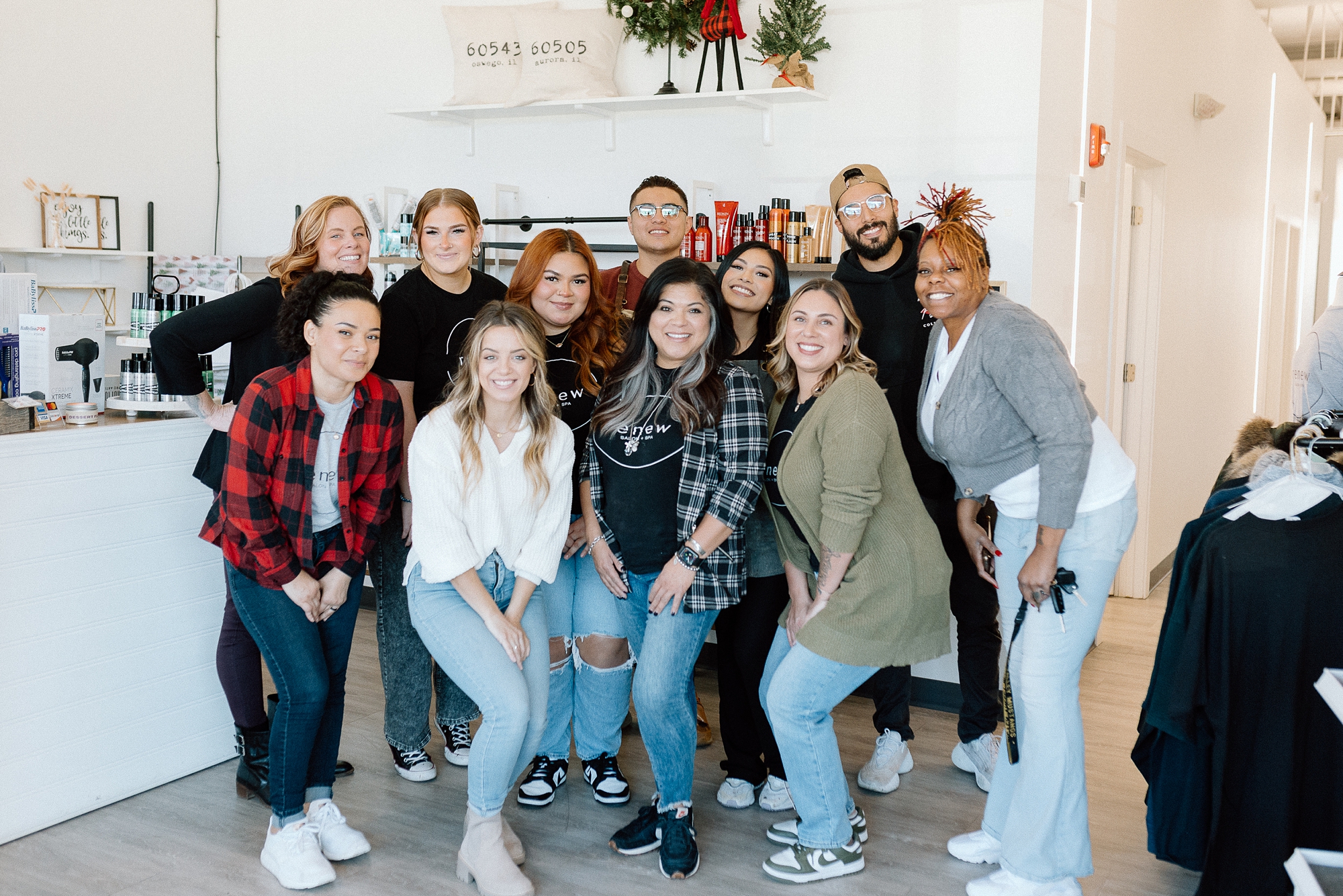 Owners of Aurora IL small businesses unite to host a community outreach event, providing free photos and haircuts for guests of Hesed House.